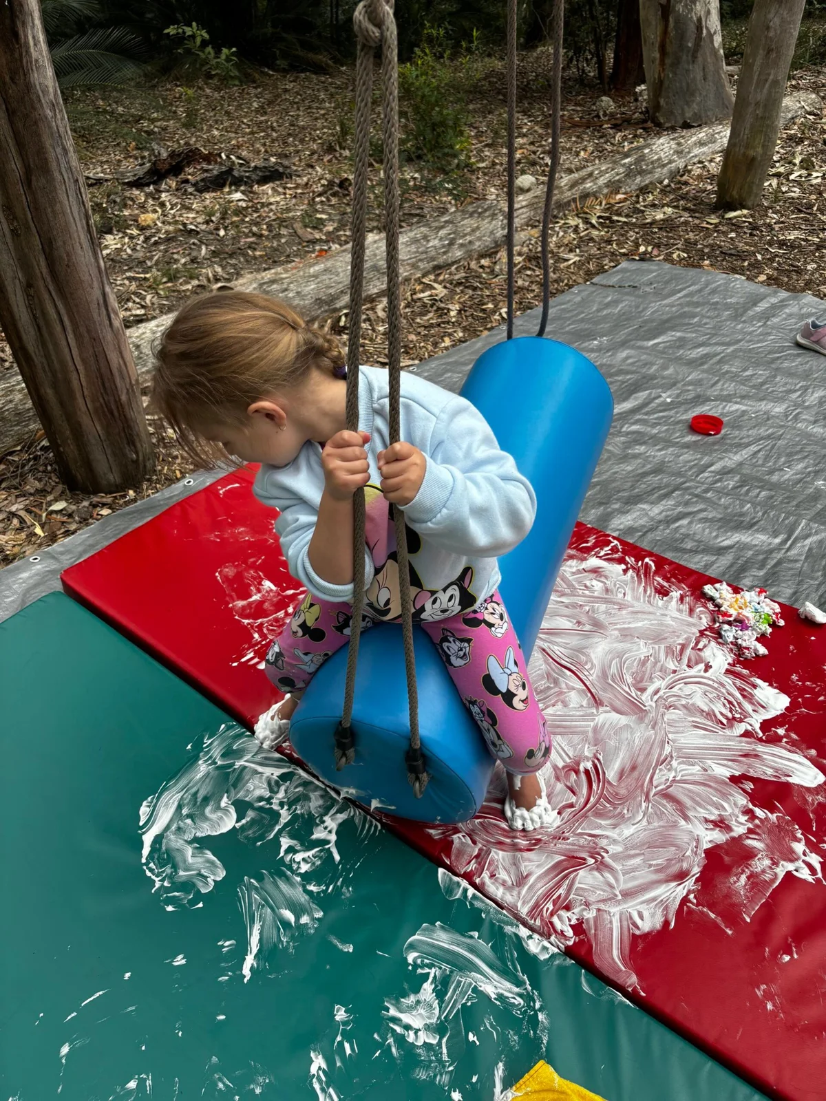 Swinging into sensory discovery Messy play meets movement as this little one explores texture, balance, and coordination, unlocking growth through sensory integration