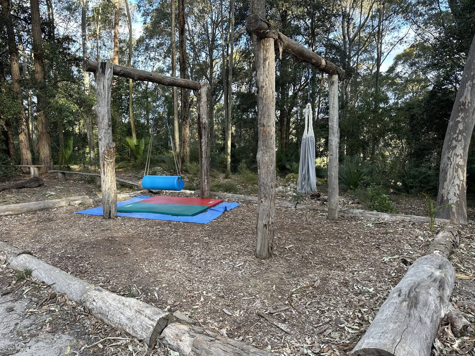 Swings and outdoor therapy equipment in the bushland clinic.